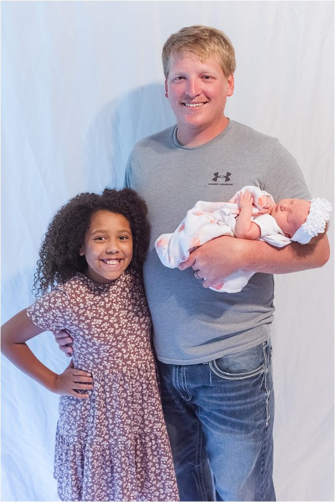 newborn family dad with girls