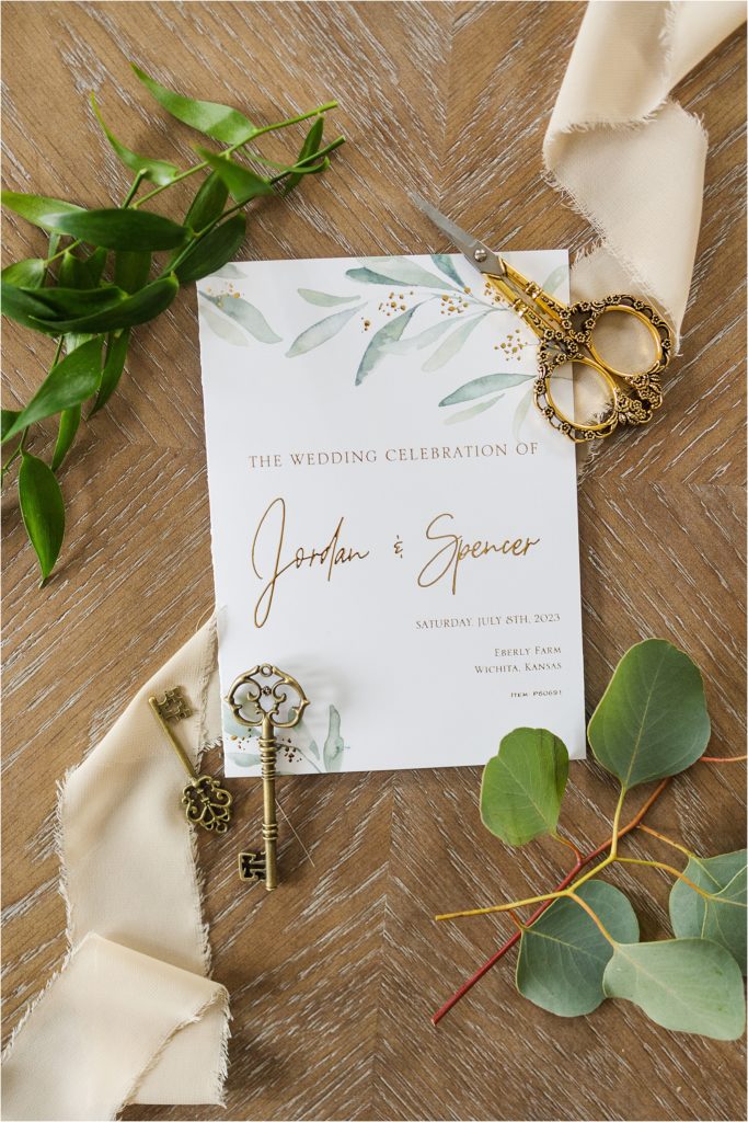 simple white invitation with greenery Blue and gold wedding inspiration at The Brownstone in Topeka, Kansas | Kelsey Alumbaugh Photography | #weddinginspiration #brownstoneTopeka #Springwedding #summerwedding #bluegoldwedding 