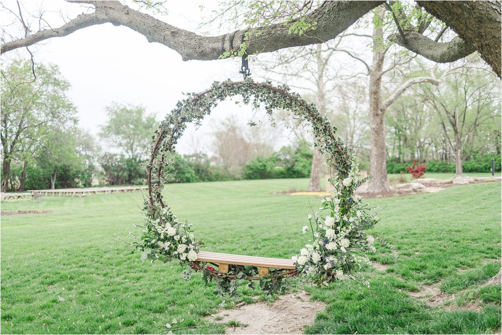 floral swing Blue and gold wedding inspiration at The Brownstone in Topeka, Kansas | Kelsey Alumbaugh Photography | #weddinginspiration #brownstoneTopeka #Springwedding #summerwedding #bluegoldwedding 