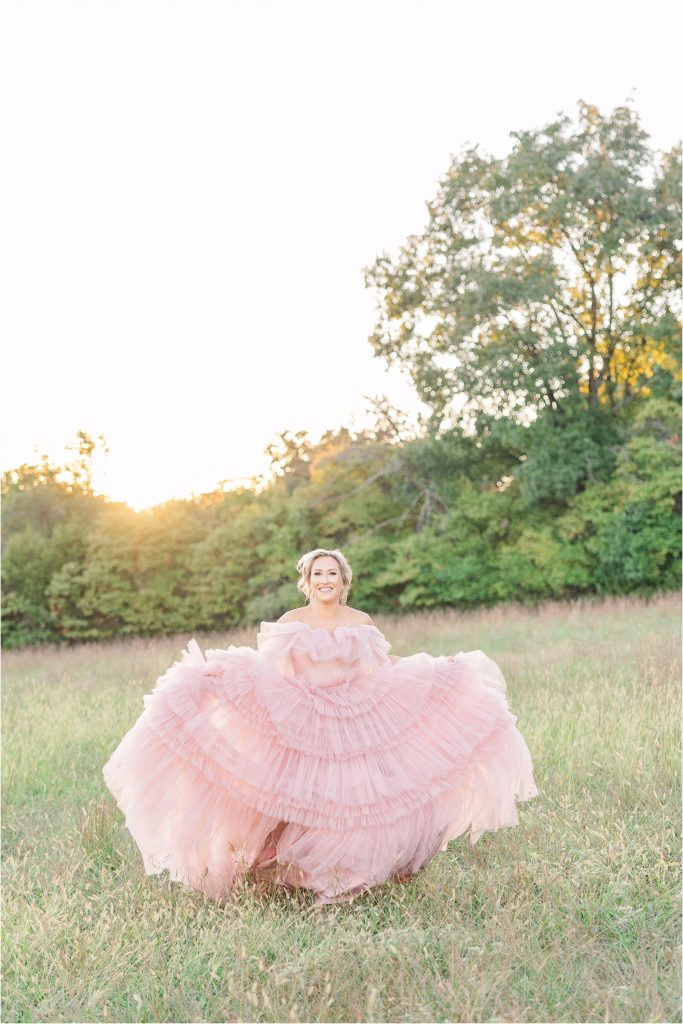 pink high fashion gown running across field bride and groom in golden hour sunlight drench fall colored field at westwind hills outside st. louis mo additional wedding cake - tan with embellishments blush and white tiered wedding cake with satin ribbon with gold shelves of wedding desserts Westwind Hills luxury wedding inspiration | Kelsey Alumbaugh Photography | #weddinginspiration #luxurywedding #stlouisweddingphotography #stlwedding #styledshootsacrossamerica