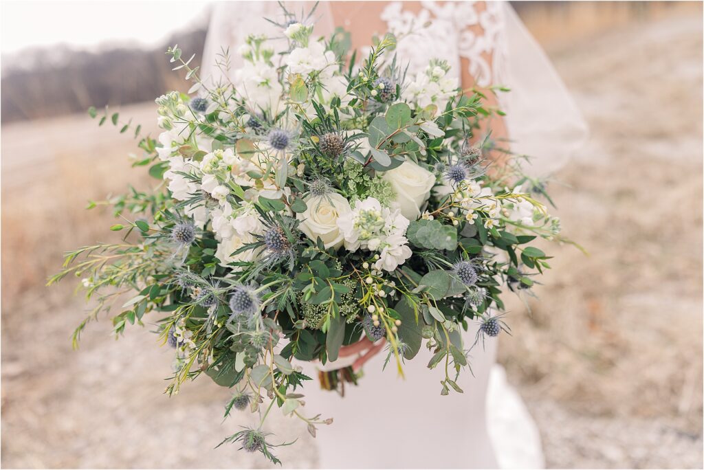 white and blue bouquet with tons of greenery at Eagle Bluff Ranch, Waverly, Mo - Haylee + Blake | Missouri River spring wedding | Kansas City wedding photographer | Kelsey Alumbaugh Photogrpahy | #kansascitywedding #missouriweddingphotographer #missourispringwedding