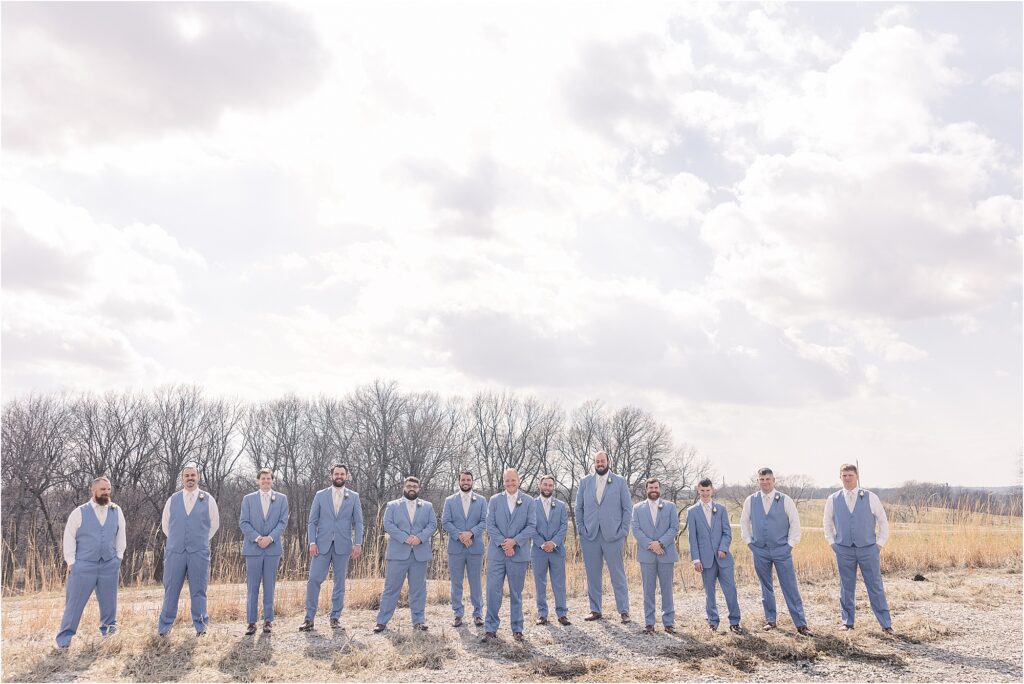 Groom with groomsmen in cornflower blue suits at Eagle Bluff Ranch, Waverly, Mo - Haylee + Blake | Missouri River spring wedding | Kansas City wedding photographer | Kelsey Alumbaugh Photogrpahy | #kansascitywedding #missouriweddingphotographer #missourispringwedding