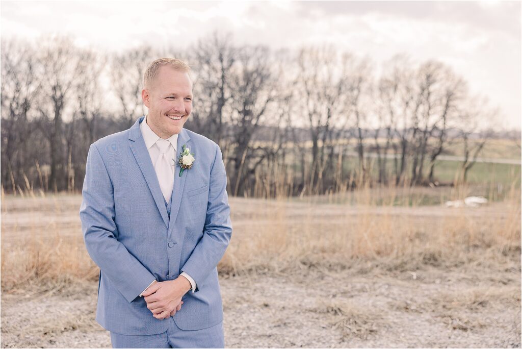 Groom in cornflower blue suit at Eagle Bluff Ranch, Waverly, Mo - Haylee + Blake | Missouri River spring wedding | Kansas City wedding photographer | Kelsey Alumbaugh Photogrpahy | #kansascitywedding #missouriweddingphotographer #missourispringwedding