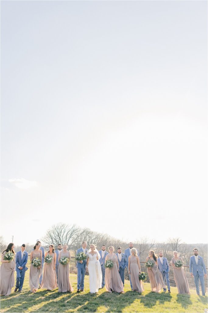 Wedding party - bridesmaids in taupe dresses and groomsmen in cornflower blue suits at Eagle Bluff Ranch, Waverly, Mo - Haylee + Blake | Missouri River spring wedding | Kansas City wedding photographer | Kelsey Alumbaugh Photogrpahy | #kansascitywedding #missouriweddingphotographer #missourispringwedding